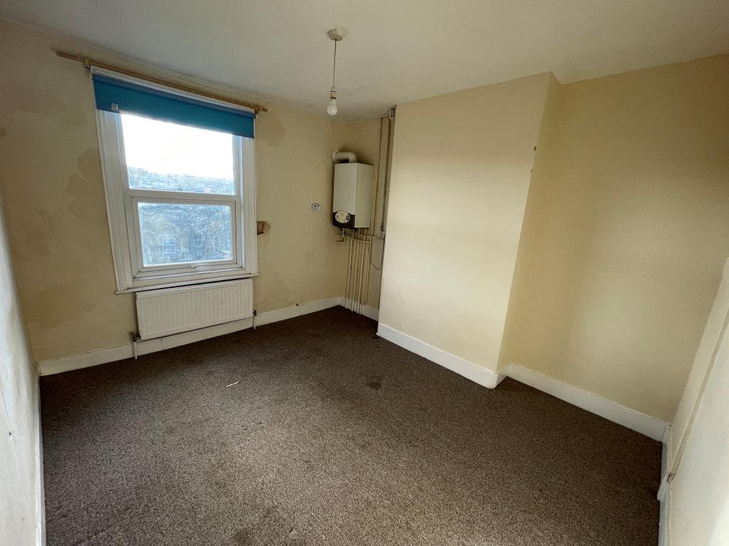 Lot: 47 - THREE-BEDROOM END-TERRACE FOR IMPROVEMENT - Bedroom with boiler